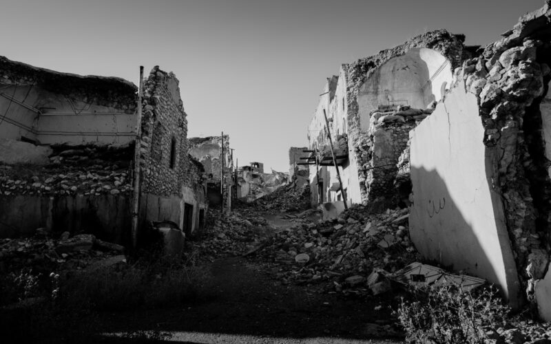 grayscale photo of concrete houses